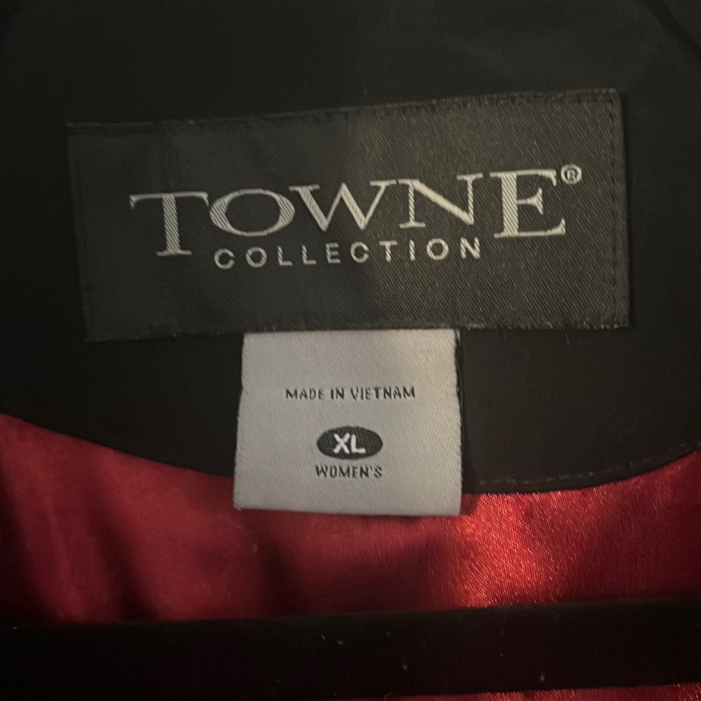 Black trench boat with red silk-like lining